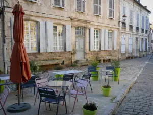 Noyers - Café terrace and houses of the medieval town