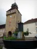 Nozeroy - Clock gateway (Clock tower), fountain and houses of the village