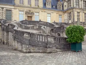 Palace of Fontainebleau - Horseshoe staircase in the White Horse courtyard (Farewell courtyard) and facade of the Palace of Fontainebleau