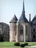 La Palice castle - Tower and Gothic chapel, lawn, cut shrubs and tree; in Lapalisse