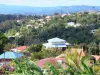 Paysages de la Martinique - Parc Naturel Régional de la Martinique : paysage verdoyant parsemé de maisons