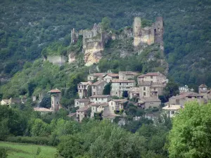 Penne - Remains of the castle (fortress), perched on a rocky mountain spur, overhanging the houses of the village (Albigensian fortified town) and trees, forest in background