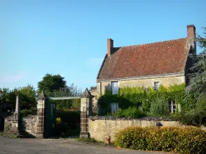 La Perrière - Ferme de la Croix farmhouse, calvary and blooming shrubs