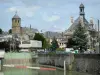 Rethel - River Aisne, bell tower of the Saint-Nicolas church and steeple of the town hall