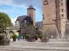Rodez - Place d'Armes square with plants, Notre-Dame cathedral made of pink sandstone and Episcopal Palace