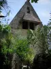 La Roque-Gageac - Church of the village and tropical vegetation, in the Dordogne valley, in Périgord