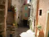 Roquebrune-Cap-Martin - Narrow street and houses with colourful facades, stone staircase, flowerpots