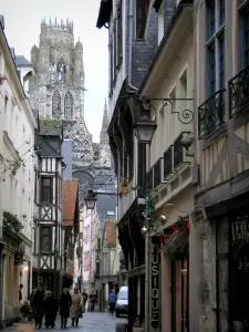 Rouen - Narrow street lined with houses and view of the tower of the Saint-Ouen abbey church