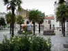 Les Sables-d'Olonne - Square decorated with rosebushes (roses), palm trees and benches, and houses of the town centre