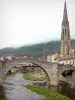 Saint-Affrique - Spire of the Notre-Dame church, houses of the old town and Pont vieux bridge spanning River Sorgue