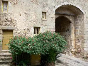 Saint-Benoît-du-Sault - Fortified gate (portal) and blooming bushes