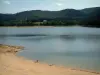 Saint-Ferréol lake - Beach, pond and hills covered with trees