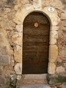 Saint-Guilhem-le-Désert - Wooden door of a house