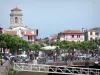 Saint-Jean-de-Luz - Bandstand and plane trees of the Place Louis XIV square, houses in the old town and tower of the Saint-Jean-Baptiste church