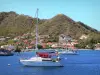 Les Saintes - Base di Anse du Cure punteggiato di barche e case di Terre - de - Haut