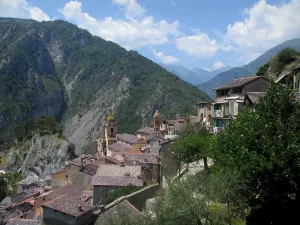 Saorge - Bell towers and roofs of houses in the hilltop medieval village overlooking the Roya valley, and mountains