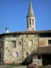 Sarrant - Bell tower of the Saint-Vincent church and facades of houses in the medieval village