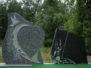 Sidobre - Granite gravestones and forest in background in the Upper Languedoc Regional Nature Park