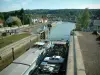 Skippers town - Longueil-Annel: lock, banks, barge navigating the side canal of the Oise river and houses