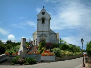 Sundgau - White church surrounded by flowers and plants (village of Riespach)