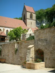 Sundgau - Fountain and church in the village of Ferrette