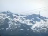 Superbagnères - Chairlift (ski lift) of the ski resort and the Pyrenees mountains with some snow