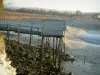 Talmont-sur-Gironde - Fishermen's huts built on stilts, suspended carrelets (fishing nets) at ebb tide