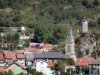 Tarascon-sur-Ariège - Bell tower of the Sainte-Quitterie church, houses of the town and Castella tower overlooking the place