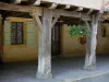 Tillac - Wooden pillars of an old house in the fortified village