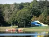 Tronçais forest - Recreational centre of the Saint-Bonnet-Tronçais lake with its water slides and paddle boats, lake and trees in the Tronçais national forest