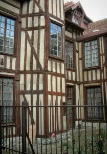 Troyes - Wooden building with its rosebush (roses) and its forged iron fence