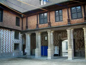 Troyes - Mauroy mansion of the Renaissance style (the Tool and Labor Thought house): facade of the inner courtyard with Champagne checkerboard (brick and chalk), columns and festive decoration