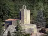 Vals rock church - View of the Sainte-Marie church and its bell tower, trees in the background