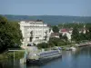 Vernon - River Seine, moored barge, building and houses of the town