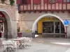 Villeneuve-sur-Lot - Restaurant terrace and arcades of the Place Lafayette square