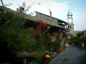 Yvoire - Flower-decked houses and bell tower of the Saint-Pancrace church