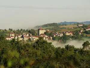 Village emerging from the mists of September