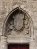 Gate of the old tower fortification: coat of arms kings of France surrounded the collar of the Order of Saint-Michel