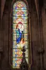 Stained glass window in the choir of the Notre-Dame church -in-his-Nativity (© JE)