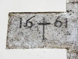 Engraved stone from 1661, in the church (© JE)