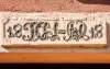 Lintel with ornate inscription (© JE)