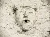 Visage sculpté, sur un mur (© J.E)