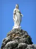 柴兰 - 处女的雕象在岩石峰顶顶部