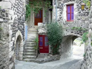 Alba-la-Romaine - Trappe gate and stone facades of the medieval town