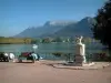 Annecy - Bank of the Europe gardens with benches and view of Lake Annecy, plane trees of the Albigny avenue and mountains