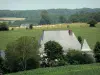 Ardennaise Thiérache - View of the roof of the fortified farm of Maipas (fortified house located in the town of Prez) and the Ardennes grove; in the Ardennes Regional Nature Park