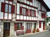 Ascain - Half-timbered facades of houses and red shutters