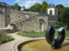 Auvers-sur-Oise - Auvers castle park with pond decorated with a modern sculpture and stairs leading to the castle