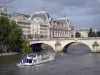 Banks of the Seine river - Boat cruise on the Seine river with a view of the Pont Royal bridge and the Orsay museum