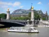 Banks of the Seine river - Shuttle boat sailing on the Seine river, Pont Alexandre-III and Great Palace